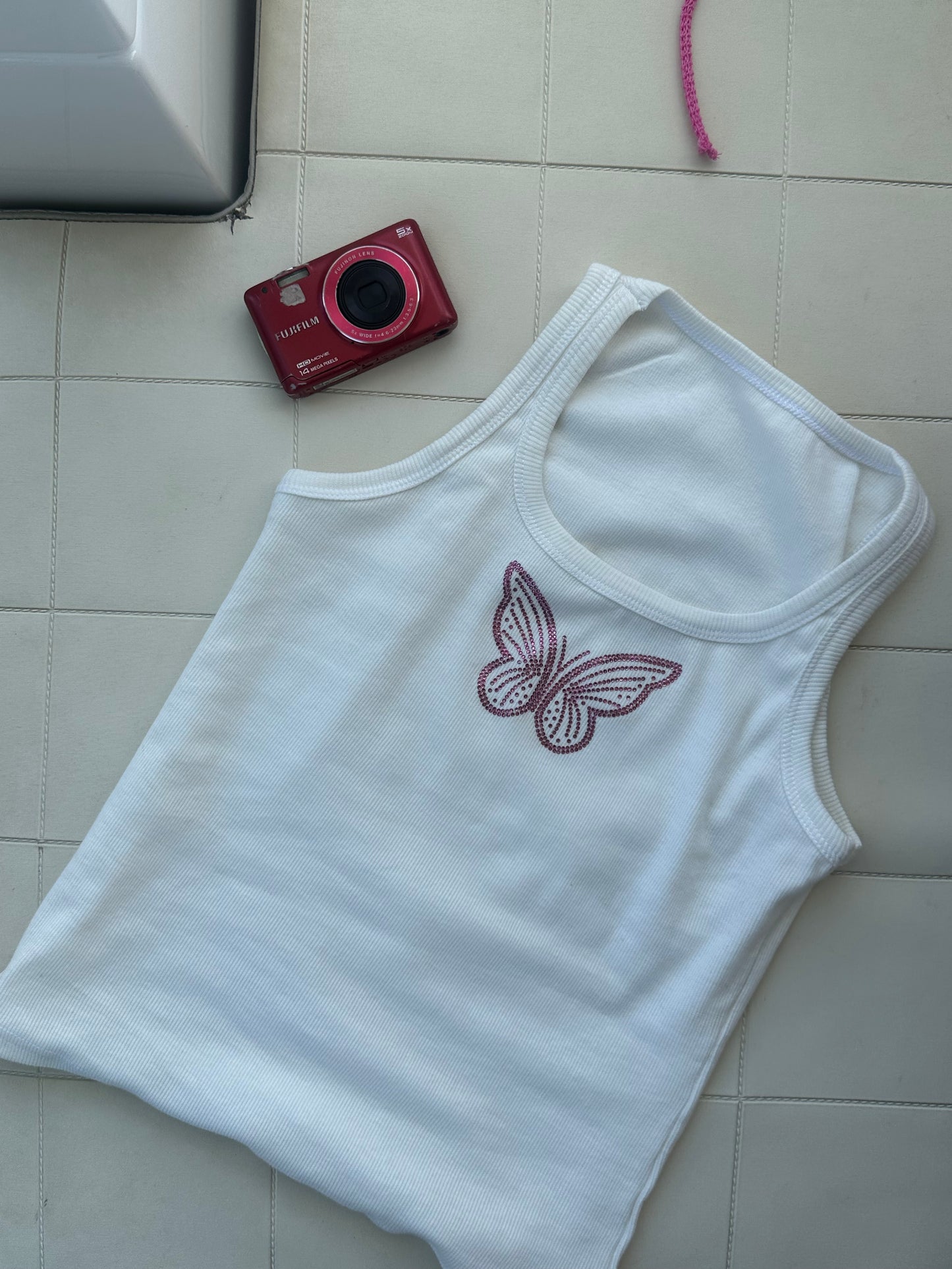 The pink butterfly tank top